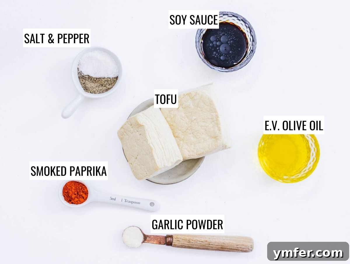 Effortless Crispy Air Fryer Tofu 4 Air fryer tofu ingredients laid out on a table.