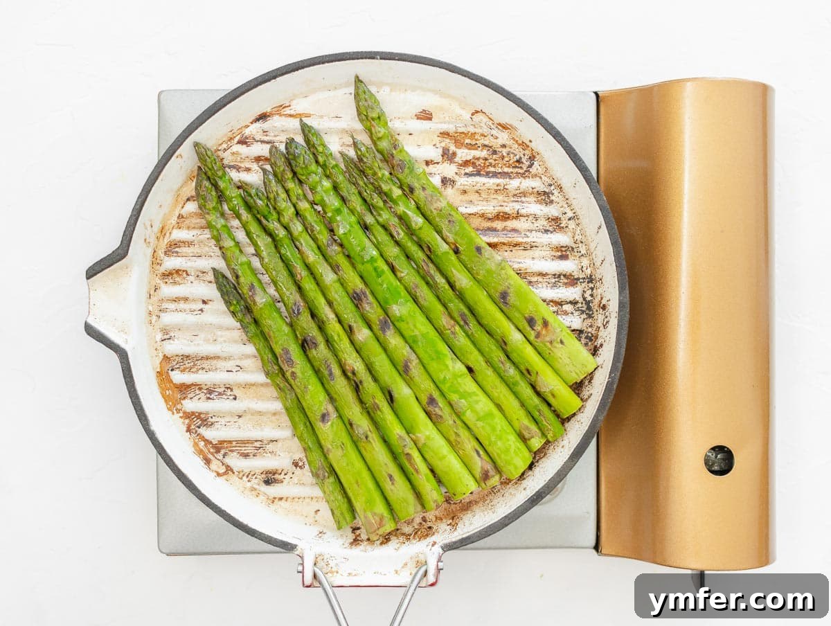 Perfectly grilled asparagus spears on a plate, ready to be served