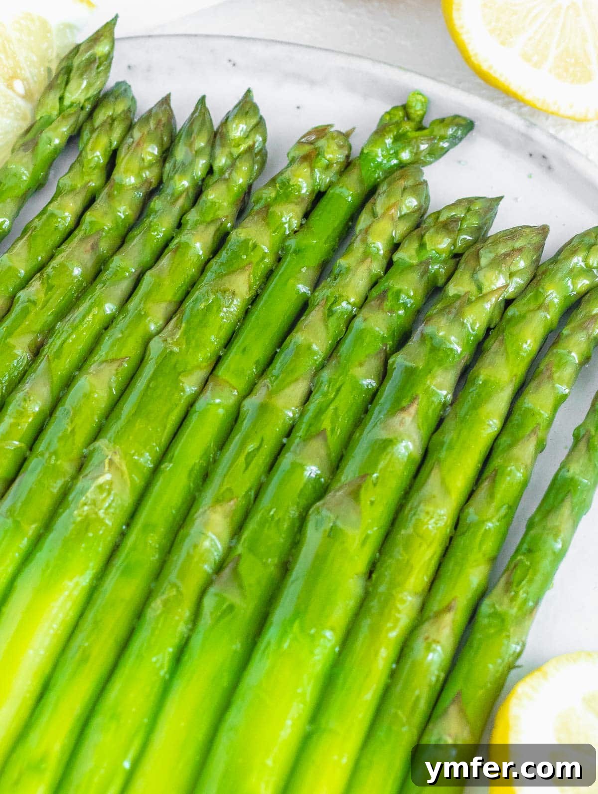 Perfectly Boiled Asparagus 2 Vibrant green boiled asparagus spears arranged beautifully on a plate