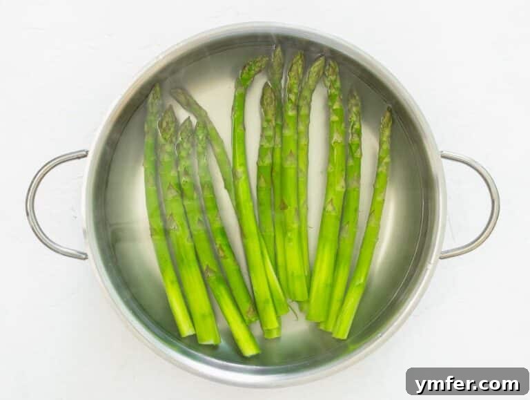 boiling asparagus in a large pan