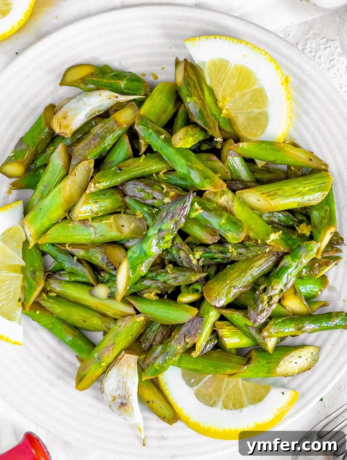 Sautéed asparagus with lemon and parmesan, elegantly plated.
