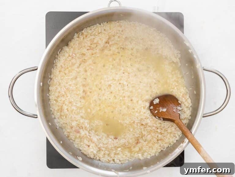 Spring Green Risotto 28 adding vegetable stock a ladleful at a time