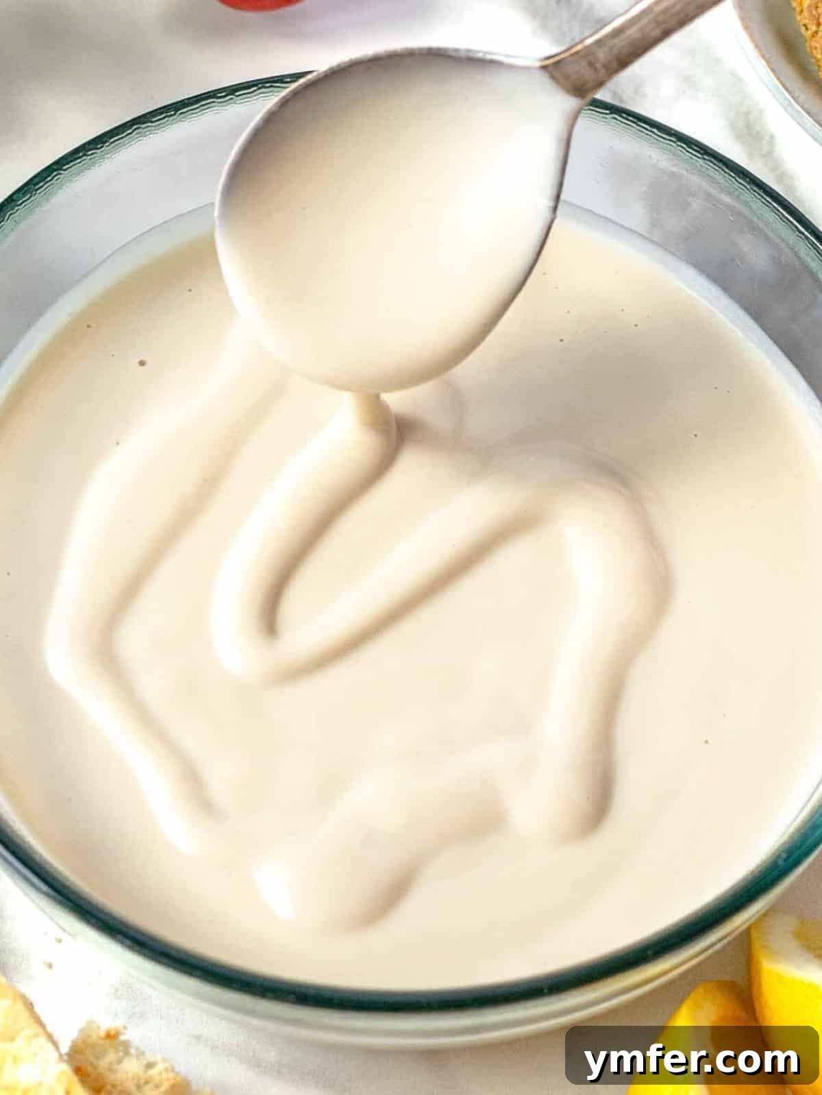 Silky Tahini Drizzle 2 Creamy Tahini sauce recipe, drizzled over a vibrant dish.