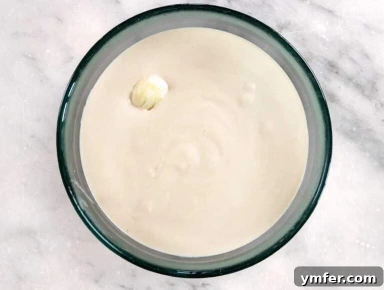 Silky Tahini Drizzle 10 Tahini sauce with a whole clove of garlic