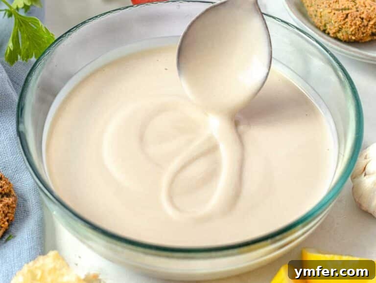 Silky Tahini Drizzle 11 creamy tahini sauce in a glass bowl
