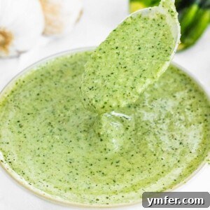 A bowl of vibrant green zucchini pesto, perfect for pasta