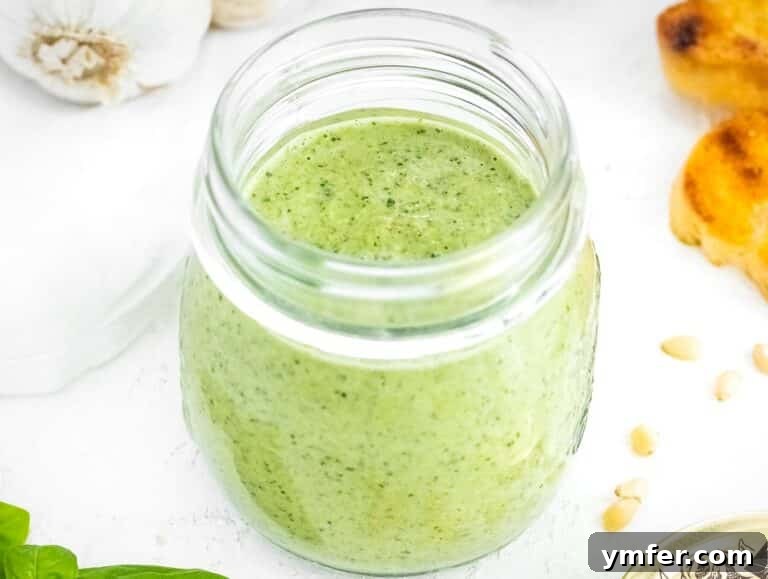 Silently, I'll translate "Zucchini Pesto" to English, verify it's already English, and then provide it as the final, unique title without any extra text or formatting, ensuring no special characters like asterisks or introductory phrases are included. 19 Zucchini pesto stored in a jar, ready to be frozen or refrigerated