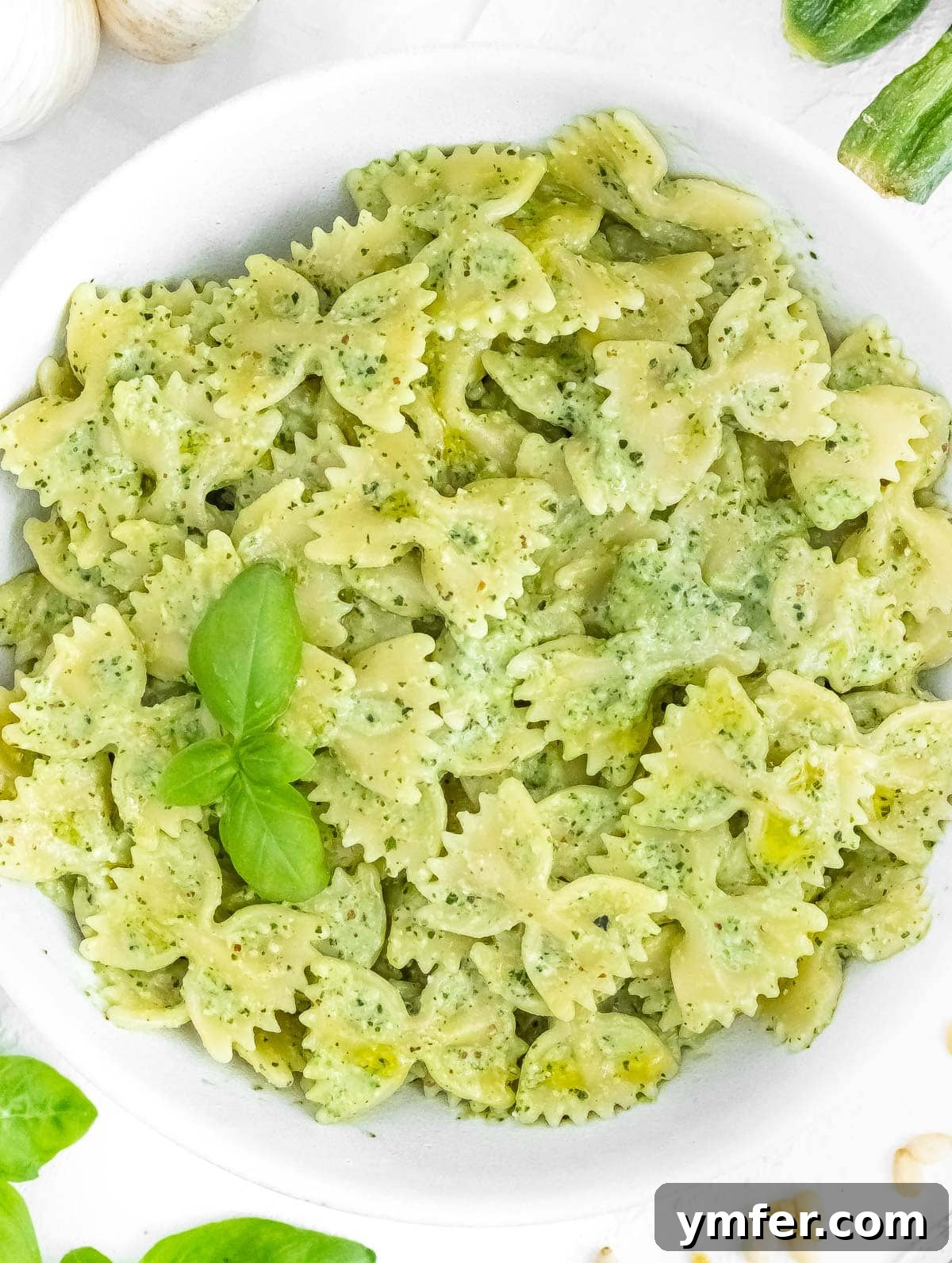 Silently, I'll translate "Zucchini Pesto" to English, verify it's already English, and then provide it as the final, unique title without any extra text or formatting, ensuring no special characters like asterisks or introductory phrases are included. 3 Delicious pasta generously coated with creamy zucchini pesto, ready to be served
