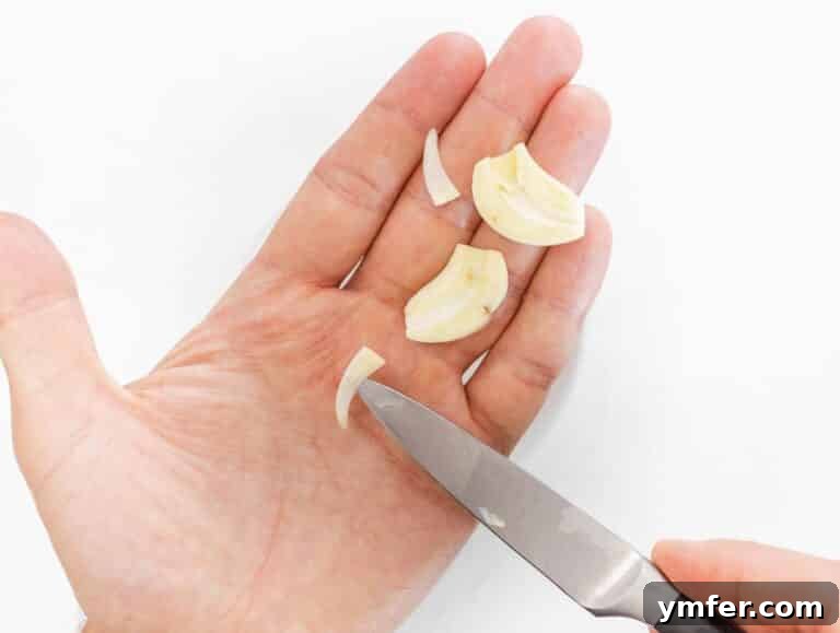 Removing the core from a garlic clove before adding to the food processor