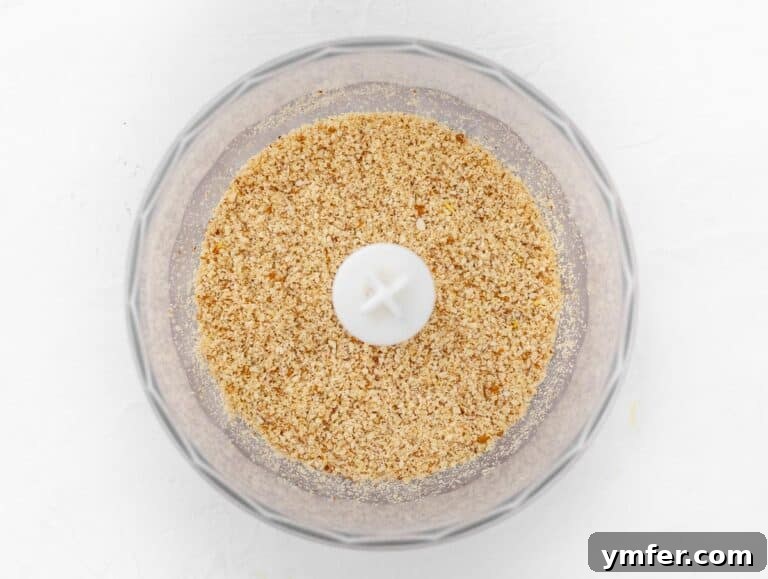 Finely coarse mixture of nuts, garlic, and salt in a food processor