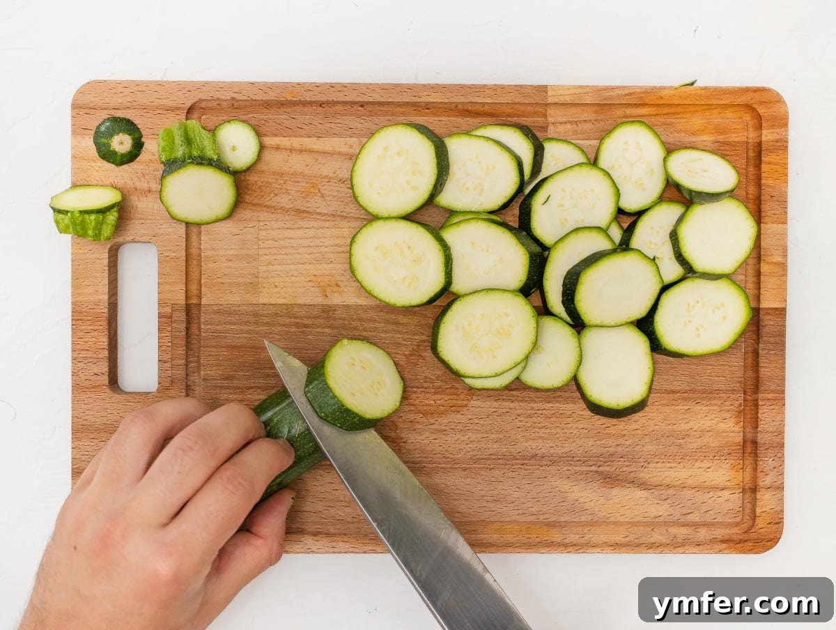 Perfectly Charred Zucchini 8 cutting round zucchini slices with a chef's knife