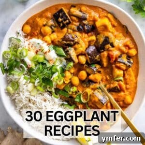 Creamy eggplant curry recipe served with basmati rice, fresh herbs, and a wedge of lime.
