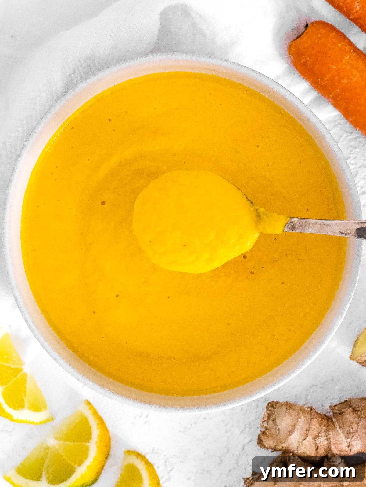 Vibrant Carrot Ginger Dressing 2 Vibrant Carrot Ginger Dressing in a bowl, ready to serve