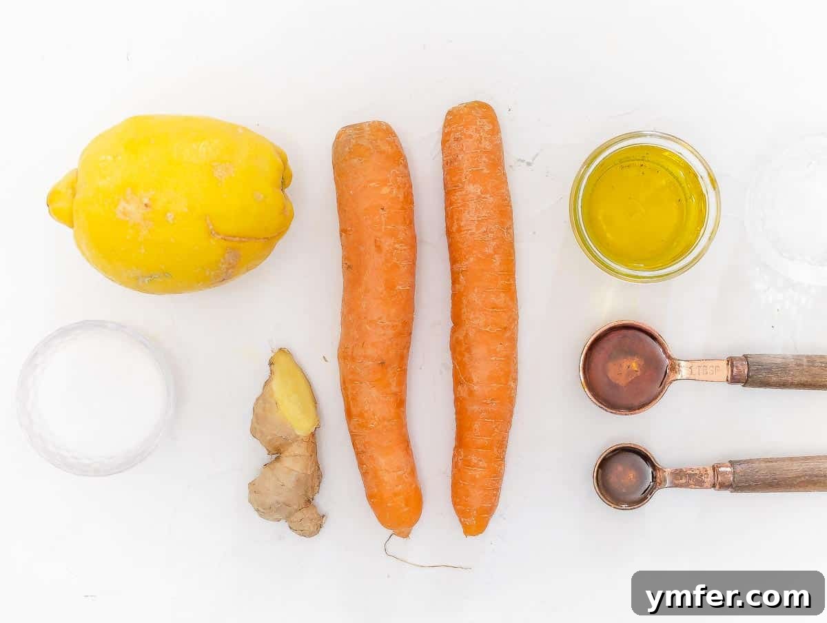 Vibrant Carrot Ginger Dressing 4 Fresh ingredients for carrot ginger dressing laid out on a cutting board.