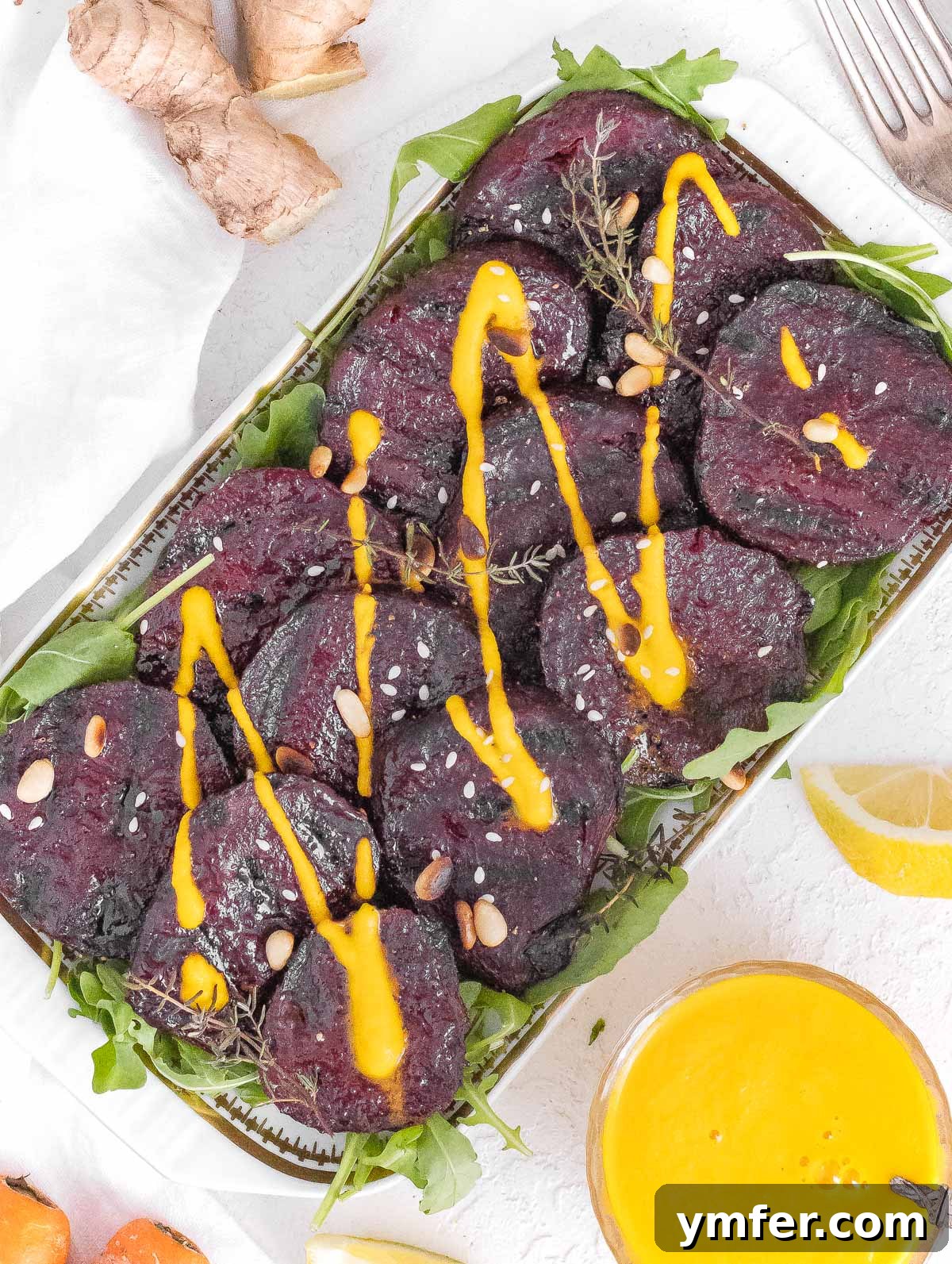 Vibrant Carrot Ginger Dressing 5 Grilled beets with carrot ginger dressing, elegantly plated.