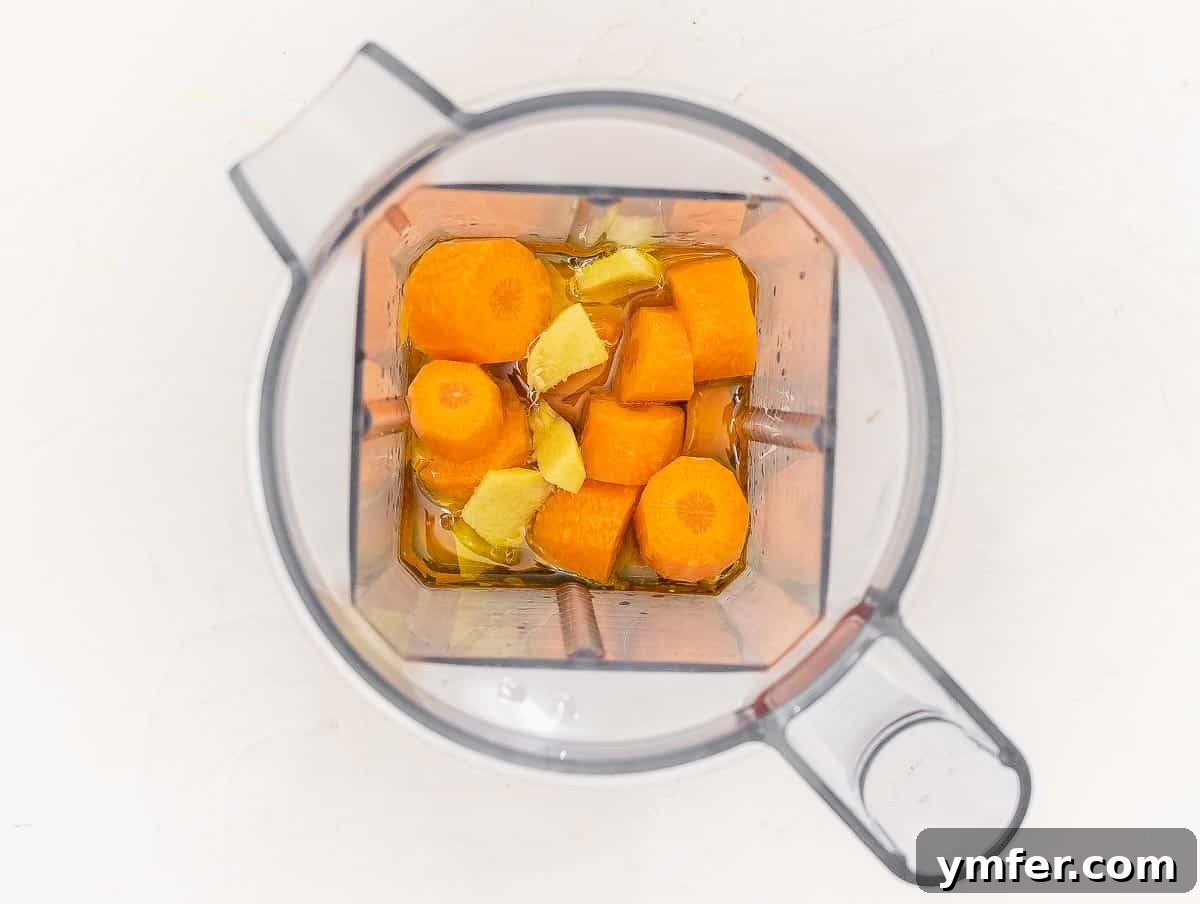 Vibrant Carrot Ginger Dressing 6 All ingredients loaded into a blender jar, ready to be processed.