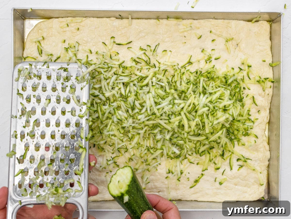 Rustic Zucchini Focaccia 12 Shredded zucchini generously spread on top of the focaccia dough.