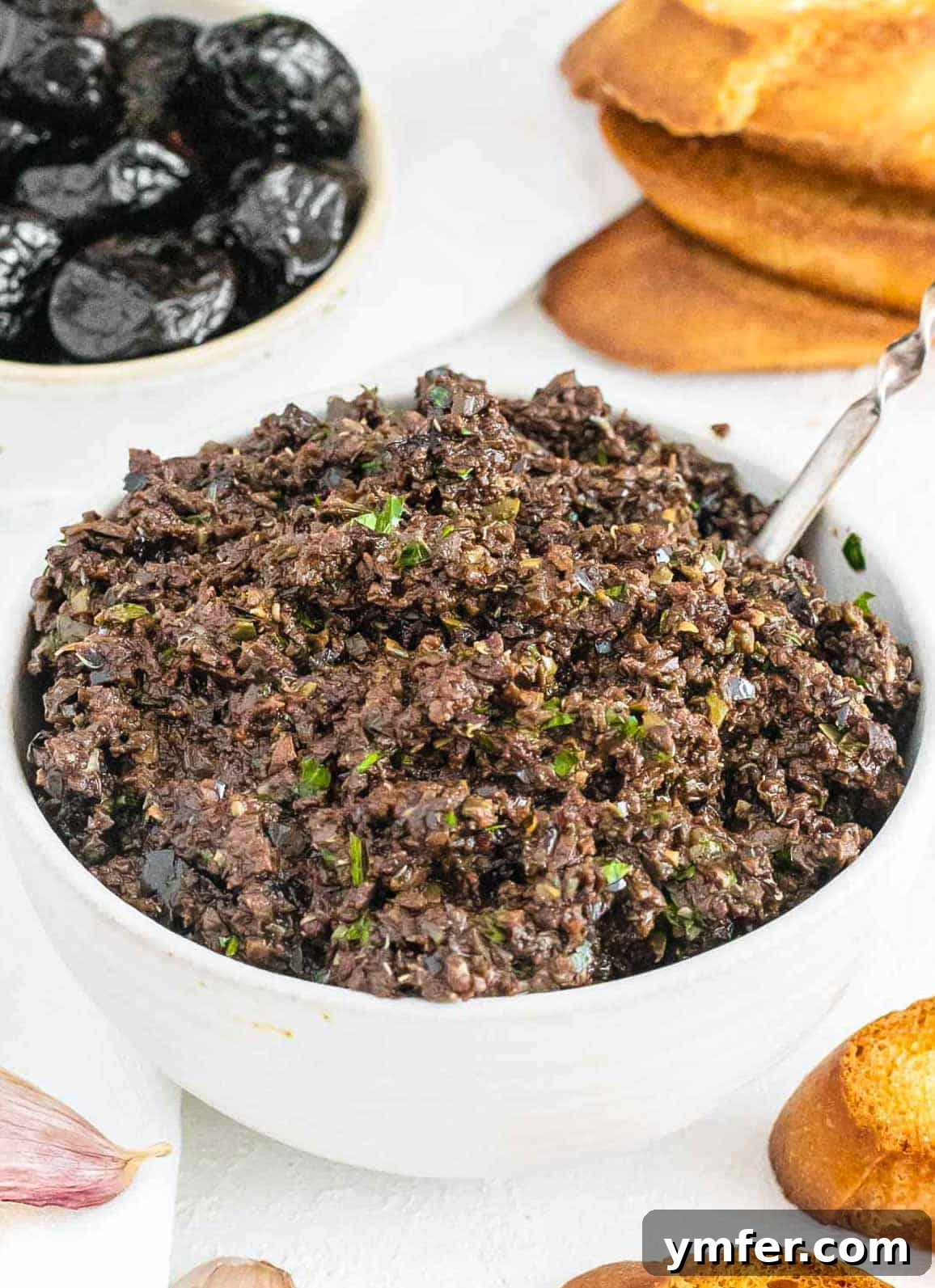 Rich Olive Spread 2 Olive tapenade in a white bowl, ready to be served