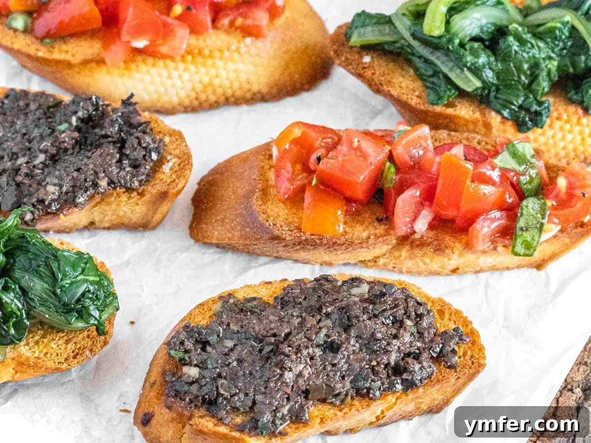 Rich Olive Spread 13 Two crostini with olive tapenade on a white plate, ready for serving