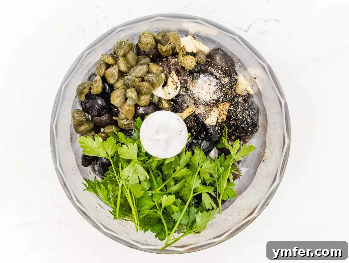 Rich Olive Spread 6 Ingredients for olive tapenade placed in a food processor