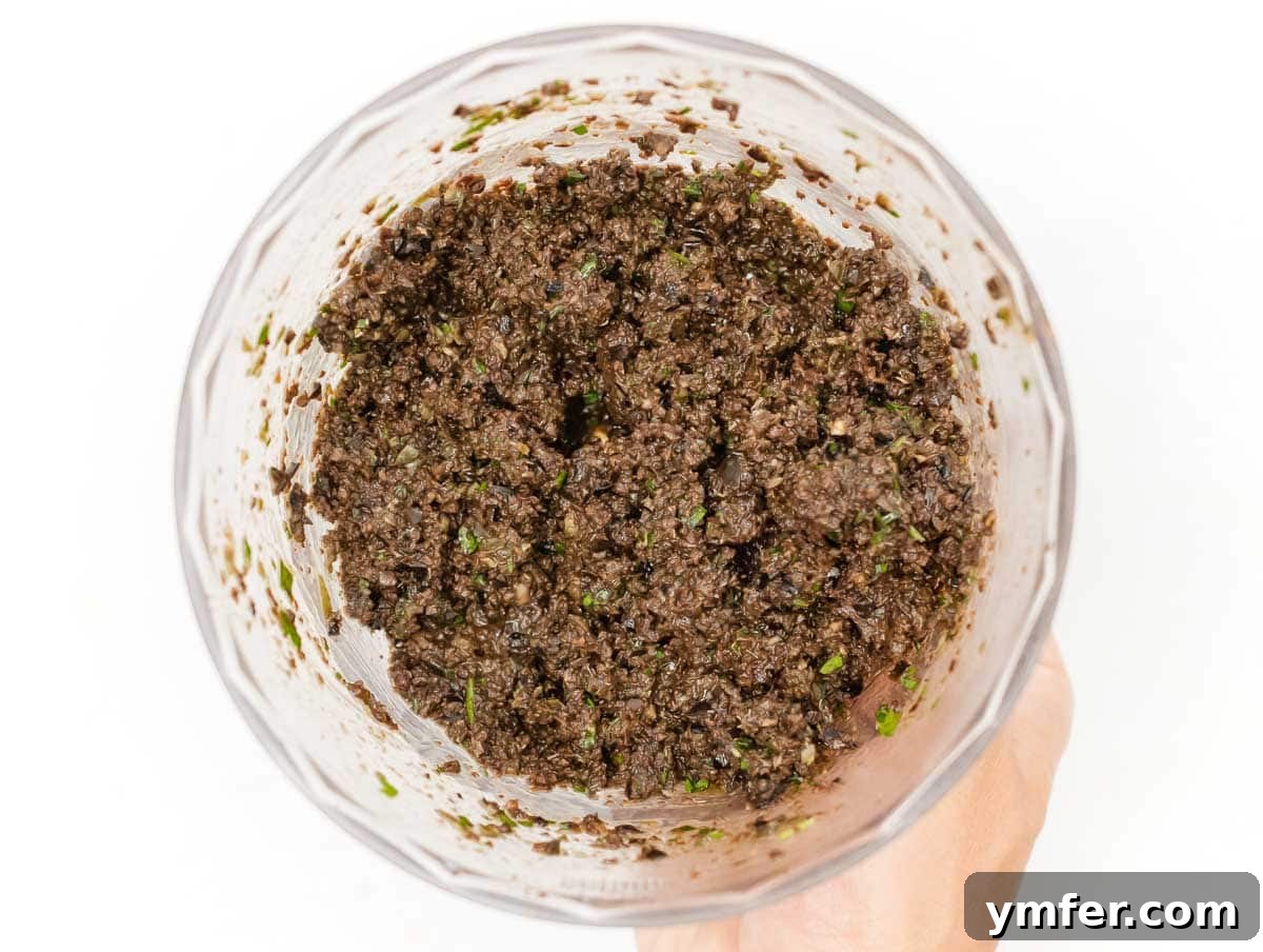 Rich Olive Spread 8 Finished olive tapenade in the food processor, ready to be scooped out
