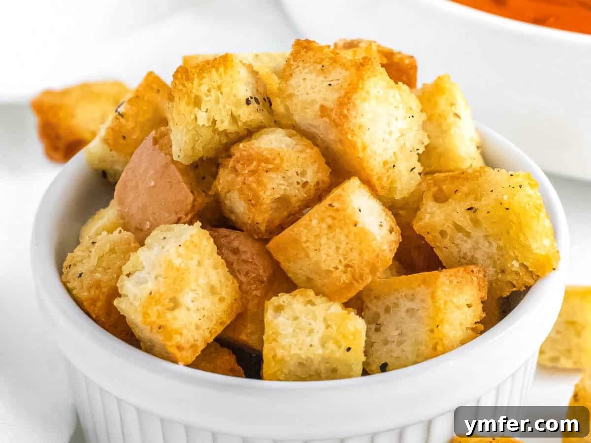 Golden Crunch Air Fryer Croutons 8 Homemade croutons. A bowl overflowing with perfectly golden and crispy homemade air fryer croutons.