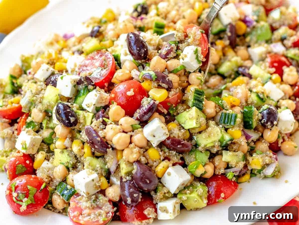 35 Vibrant Vegetarian Lunch Ideas 20 A hearty quinoa chickpea salad with crumbled feta cheese and olives.
