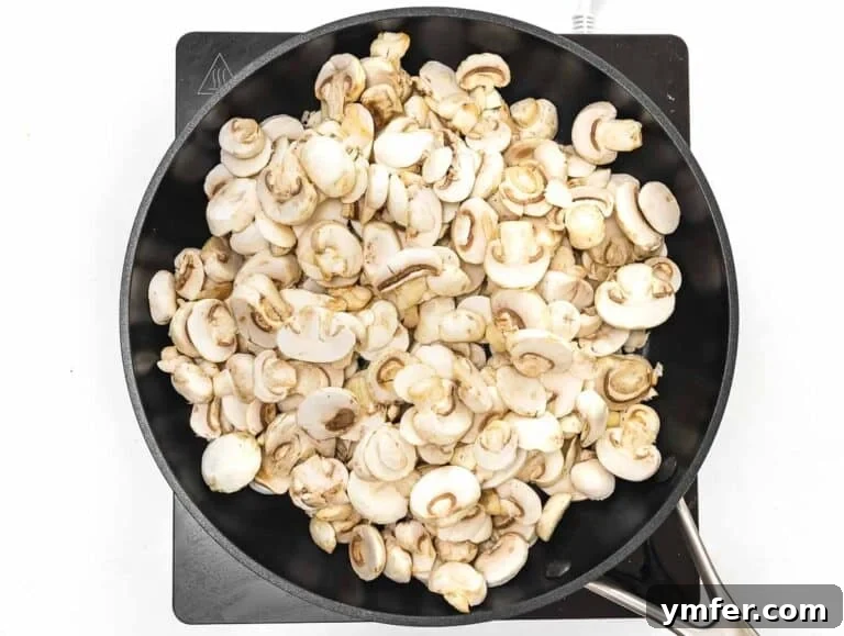 35 Vibrant Vegetarian Lunch Ideas 38 cooking mushrooms on a skillet