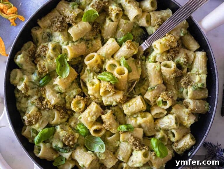 Spiralized Zucchini Delight 11 Zucchini pasta topped with lemon zest and basil pesto.
