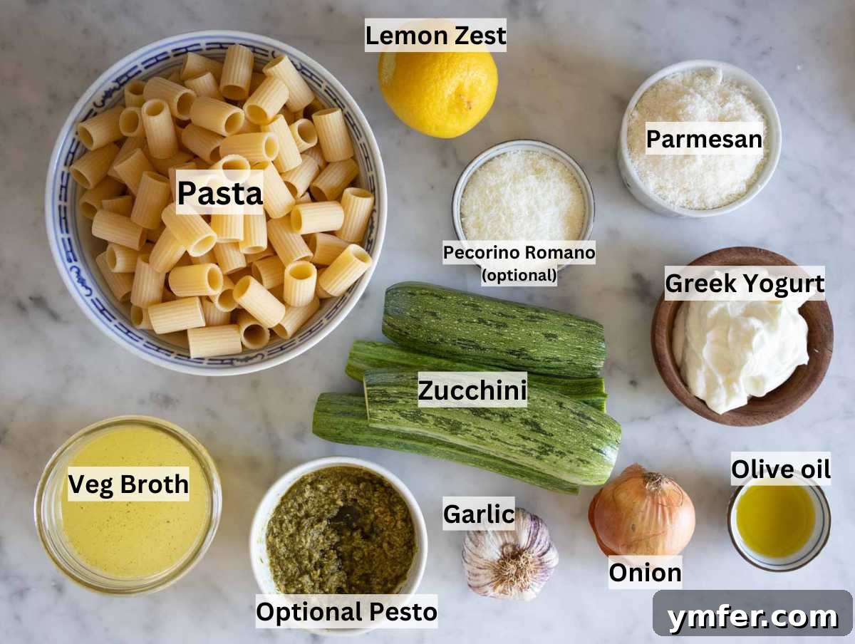 Spiralized Zucchini Delight 3 A curated selection of fresh ingredients for zucchini pasta laid out on a marble table.