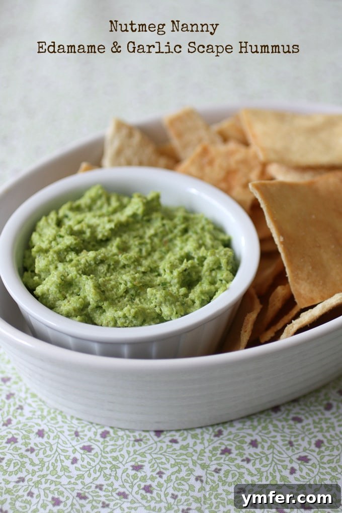 Edamame & Garlic Scape Hummus Edamame Garlic Scape Hummus in a small white bowl.