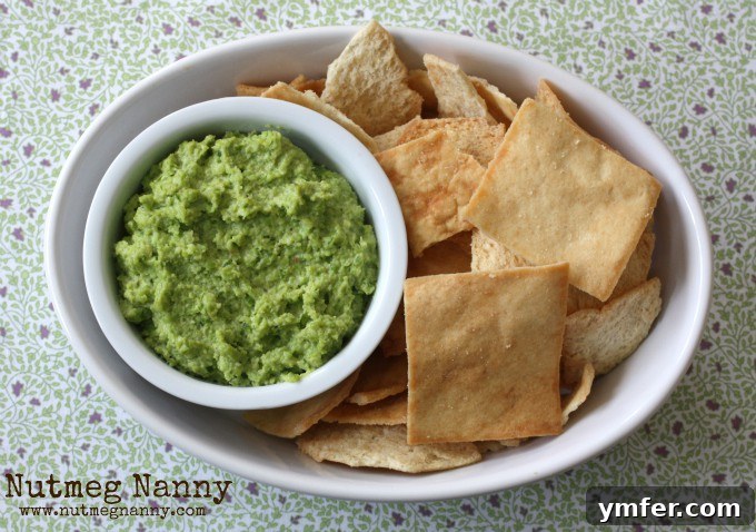Edamame & Garlic Scape Hummus Edamame Garlic Scape Hummus served with pita chips.