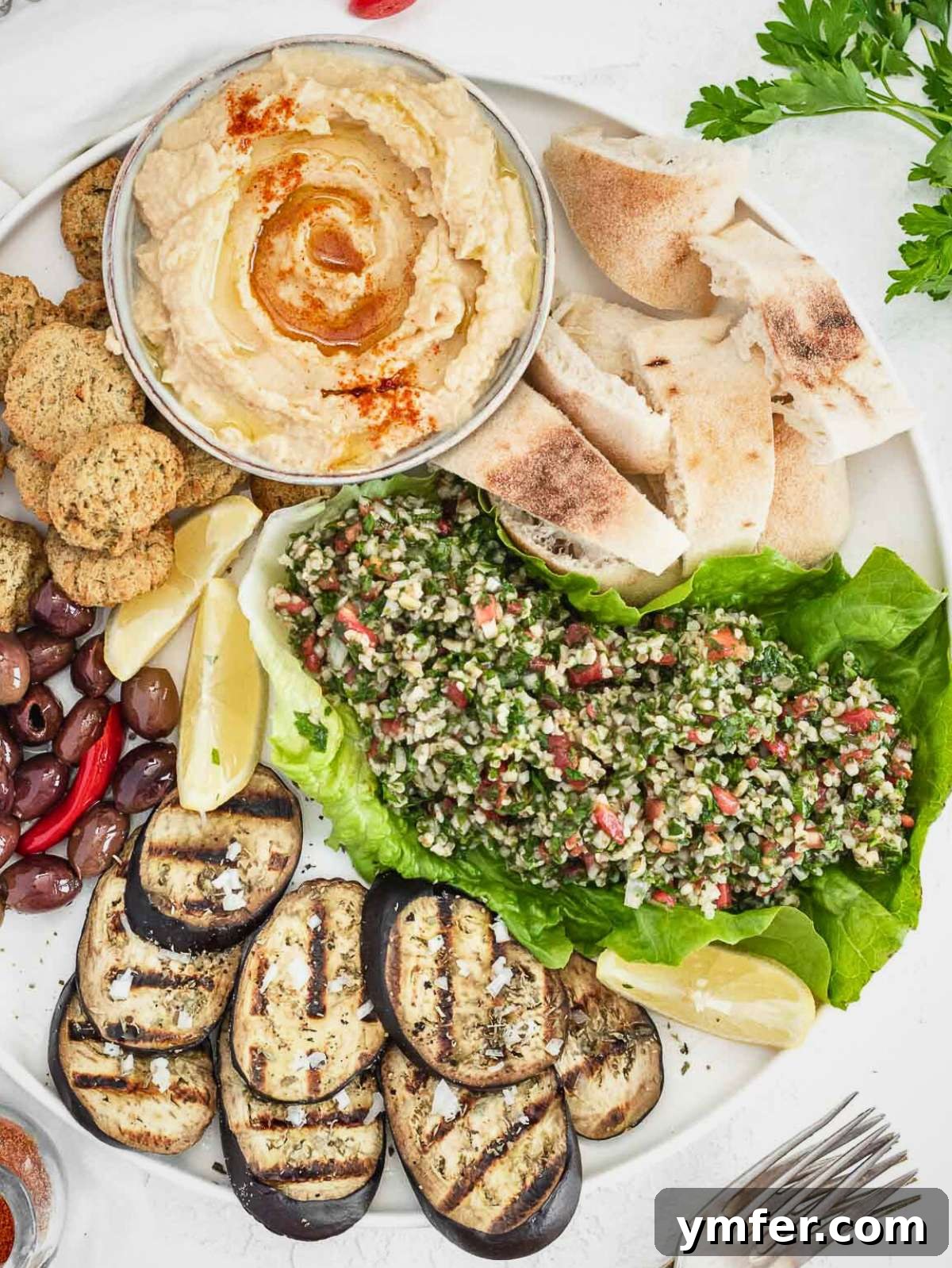 Perfect Pairings for Hummus 2 Tasty side dishes to serve with hummus on a white plate.