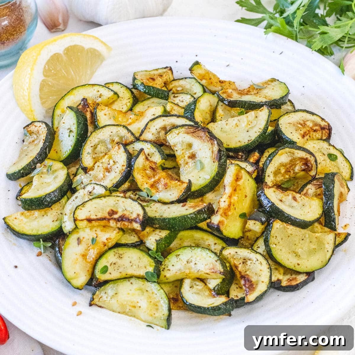 Air fryer zucchini bites on a plate.