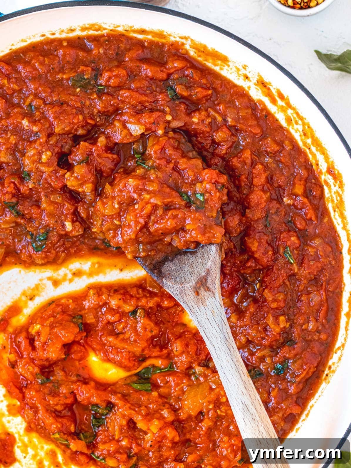Rustic Marinara 2 Marinara sauce in a skillet with a wooden spoon