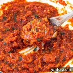 Rustic Marinara 20 Easy marinara sauce in a skillet with a wooden spoon