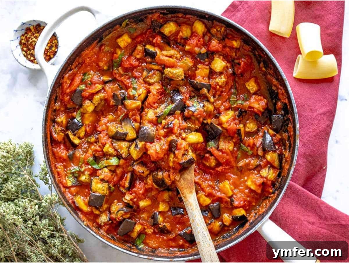 Sicilian Eggplant Pasta Delight 7 Step 3 Roasted eggplant and fresh basil stirred into tomato sauce.