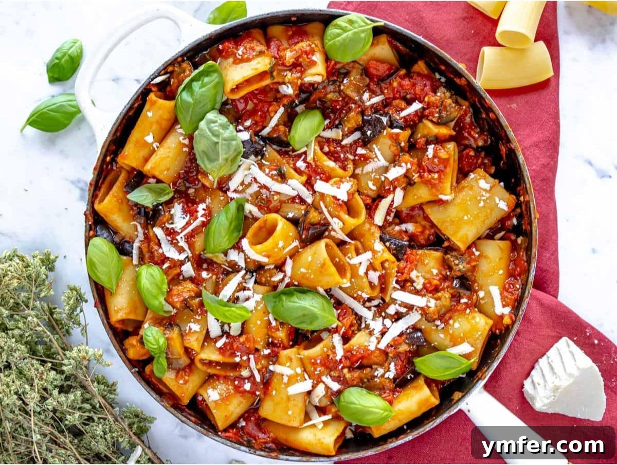 Sicilian Eggplant Pasta Delight 8 Step 4 Pasta mixed into eggplant tomato sauce with starchy water for pasta alla Norma.