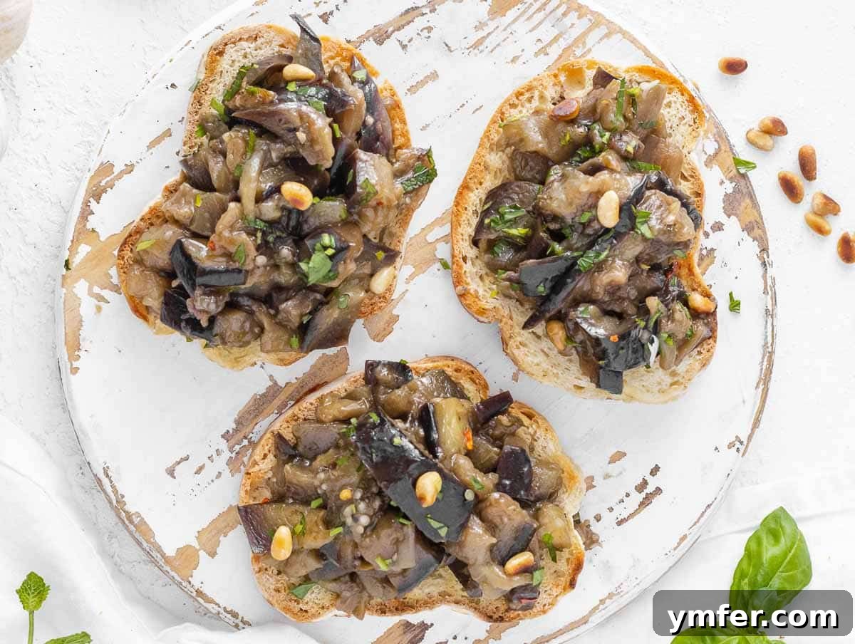 Sweet and Tangy Glazed Eggplant 3 Garnished sweet and sour eggplant served on toasted bread slices.