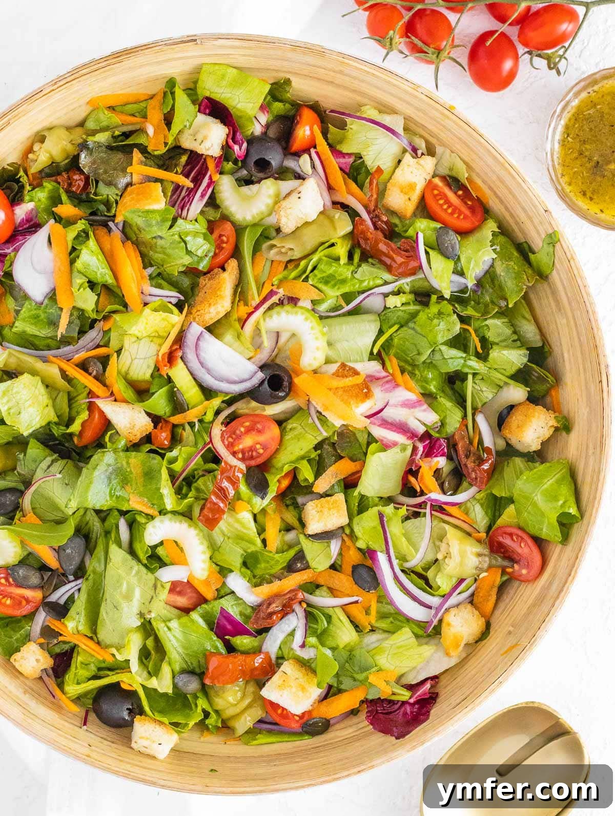 Italian salad with homemade Italian dressing, showcasing fresh ingredients and a vibrant presentation