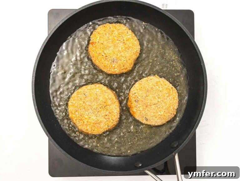 Arancini 18 shallow frying risotto cakes in a large pan