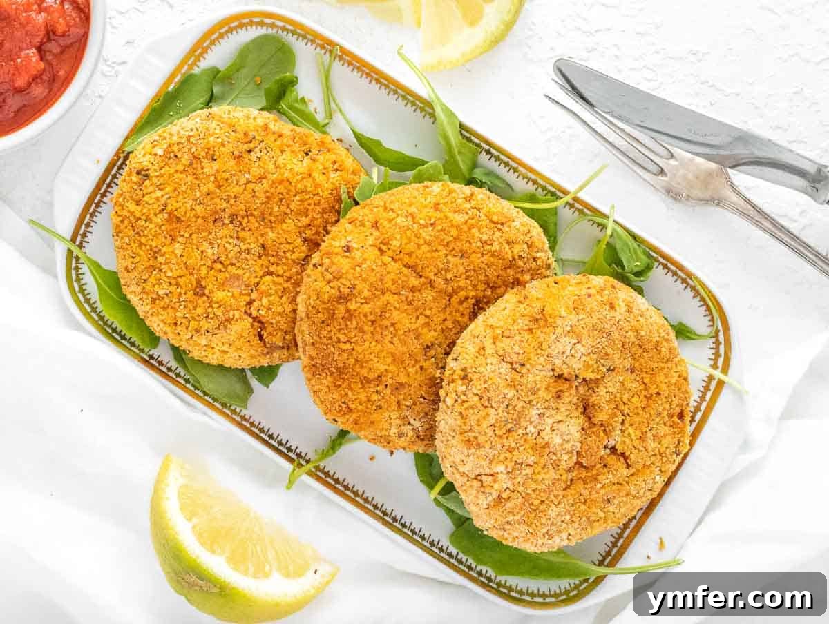 Arancini 5 Air-fried risotto cakes beautifully arranged, served with marinara sauce, arugula, and lemon wedges.