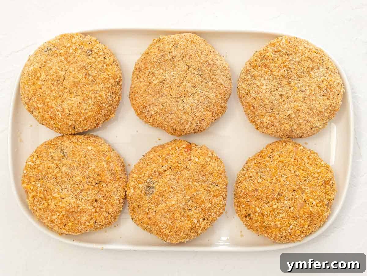 Arancini 8 Neatly arranged rice patties on a platter, coated and ready for cooking.