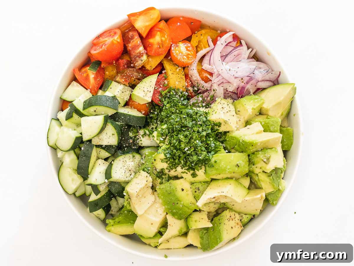 Fresh Avocado Bliss 7 Ingredients in a bowl, ready to be tossed with dressing.