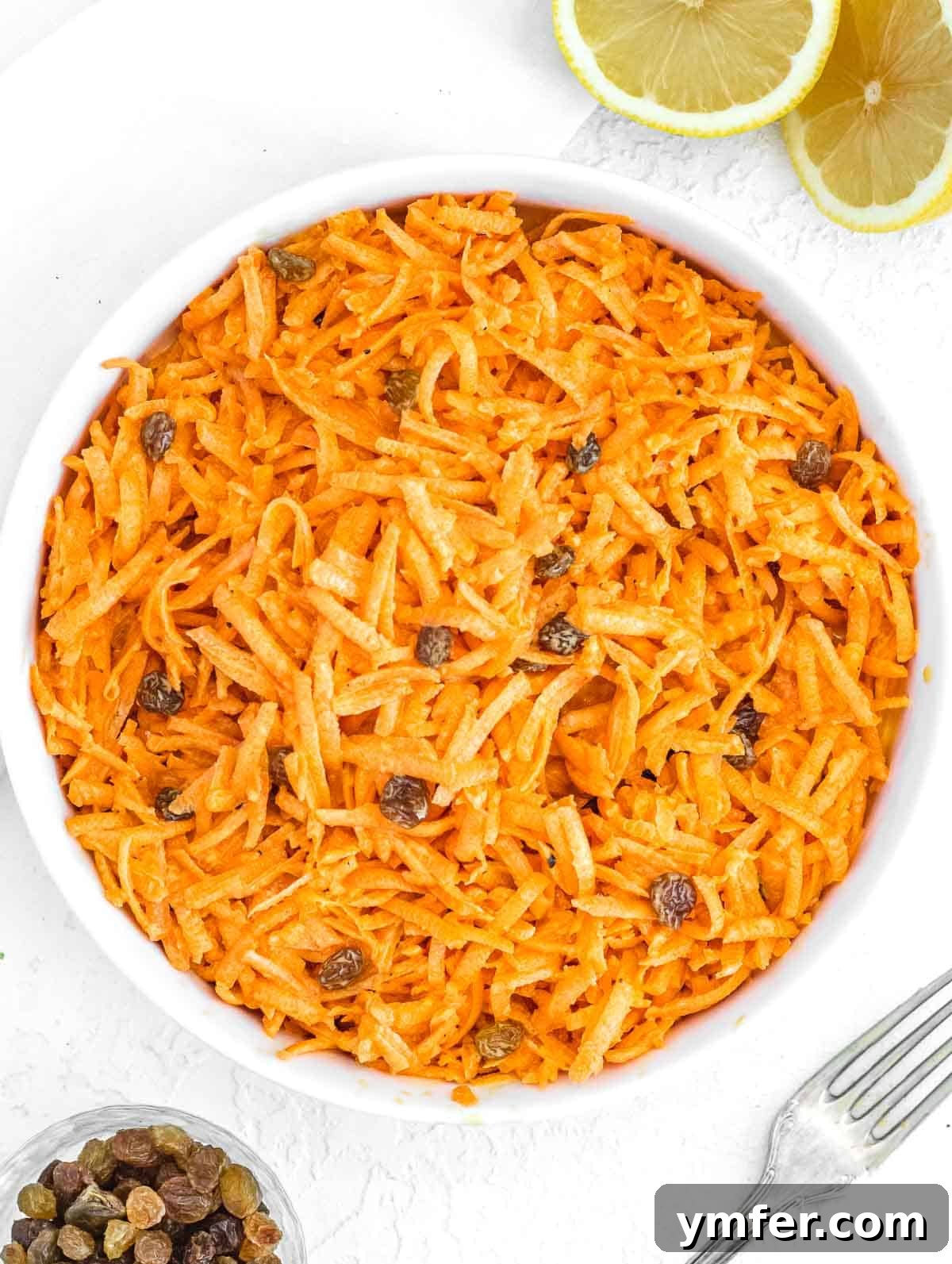 Sweet Carrot and Raisin Slaw 2 Creamy carrot raisin salad, a classic side dish with shredded carrots, raisins, and mayonnaise.