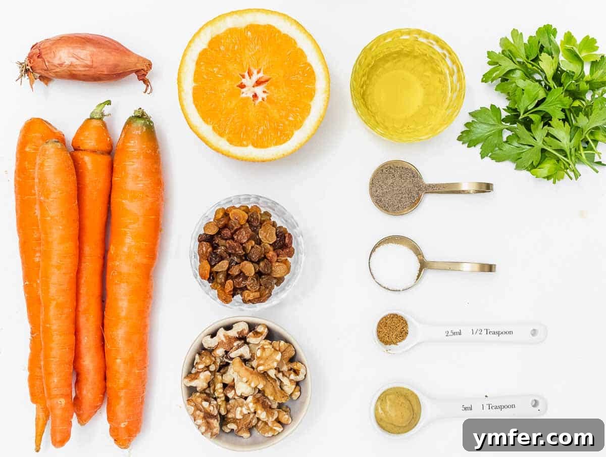 Sweet Carrot and Raisin Slaw 5 Fresh ingredients for a modern carrot raisin salad, including carrots, raisins, walnuts, shallots, orange, and spices.