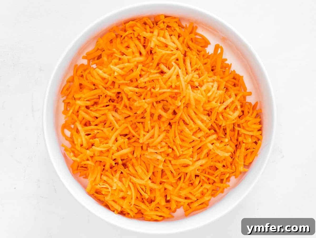 Sweet Carrot and Raisin Slaw 6 Bowl of freshly grated carrots, prepared for the salad.