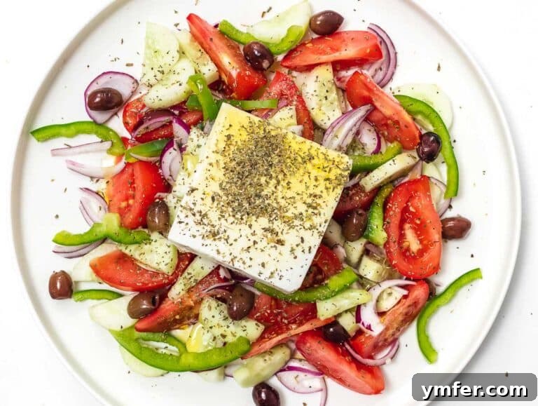 Horiatiki: The Quintessential Greek Village Salad 18 authentic Greek salad with a block of feta on top