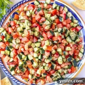 Vibrant Shirazi Chopped Salad 8 Refreshing Shirazi salad or persian cucumber served on a colorful blue platter.