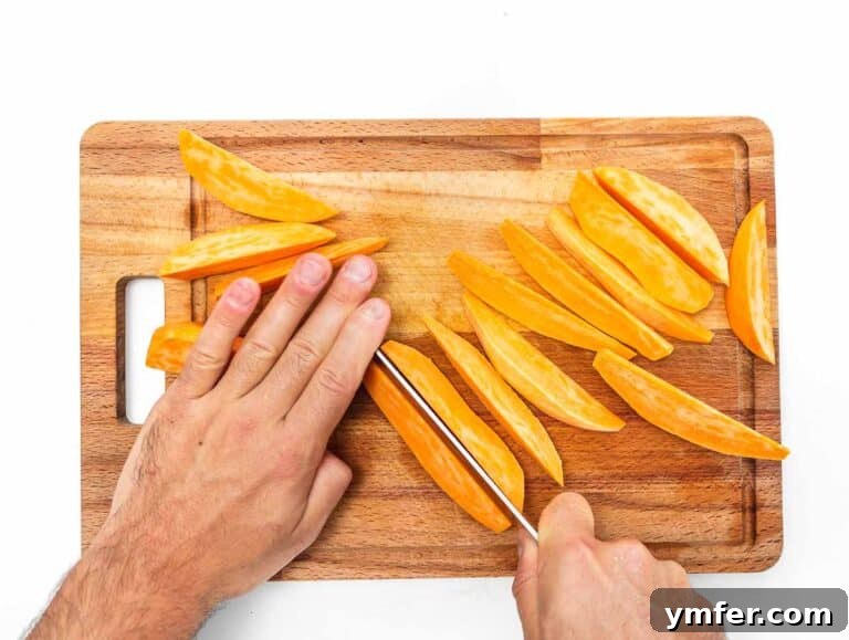 cutting the sweet potatoes into wedges